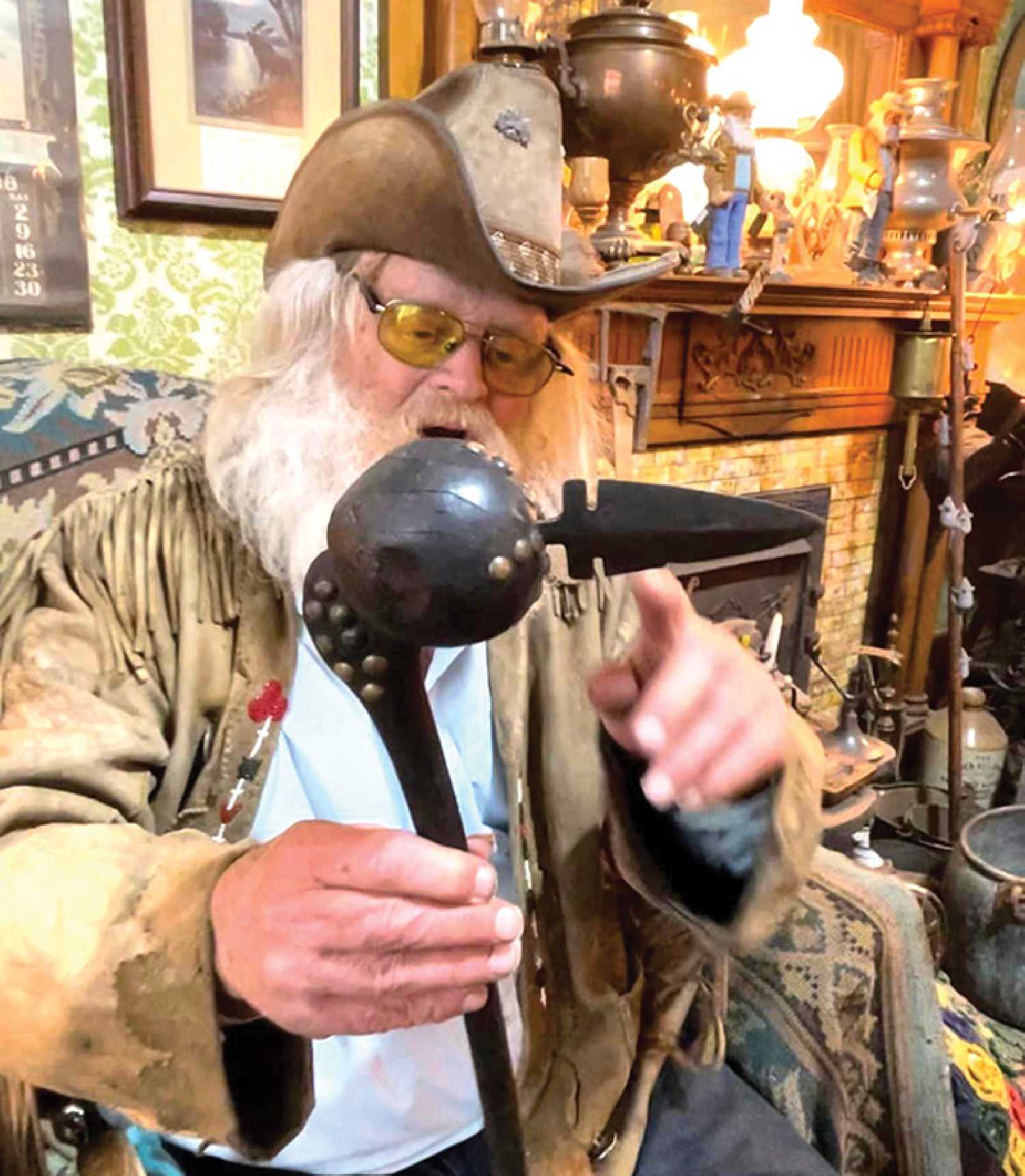 A special artifact dating back to the 1850s has been stolen from Old George’s Museum & Hidden Village, a famous roadside attraction in Whitewood. Seen here, George Chopping holds the item previous to its disappearance, a black war club embellished with brass buttons and a metal point.